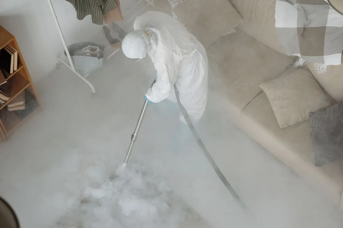 Biohazard cleanup technician in protective equipment, Vicksburg, MS